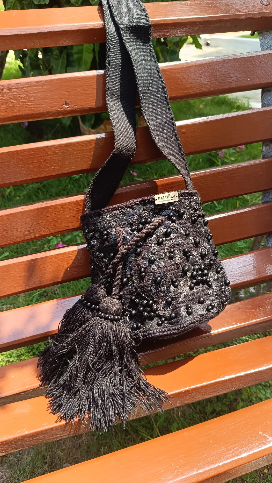 Mochila pequeña recamada · 004 negro